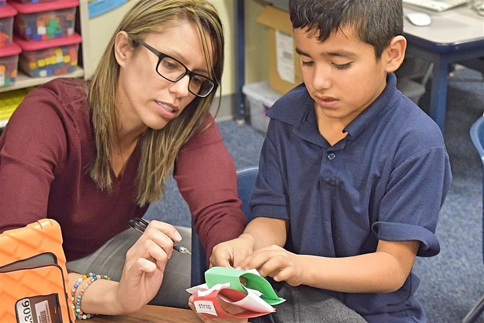 Teacher instructing student